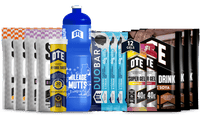 Collection of OTE sports nutrition products including drinks, bars, and gels on a white background.