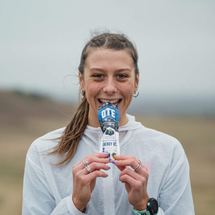 Runner enjoying an OTE Sports energy gel.